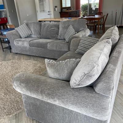 Set of couches from Ashley furniture. One has pull out bed