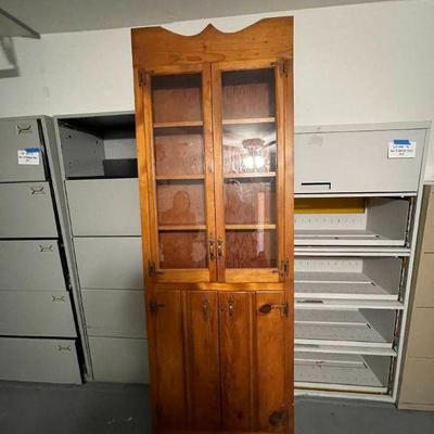 Lot 023-G: Tall Pine Cabinet

Description: 
â€¢	Rustic, sturdy and spacious unit!
â€¢	Appears to be hand-crafted; featuring...