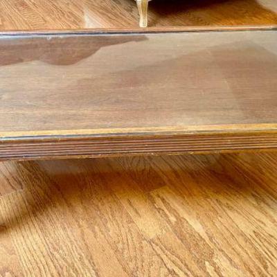 Lot 111-LR: Antique Coffee Table

Description: 
â€¢	Antique coffee table with protective top glass insert.


Dimensions: 44.5â€ W x...