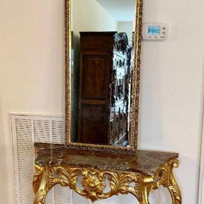 Lot 110-LR: Fancy Foyer Table & Mirror

Description: 
â€¢	Ornate gold-painted wooden foyer table with marble top and tall distinctive...