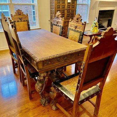 Lot 005-LR: MC Spanish Revival Dining Table and Chairs

Features: 
â€¢	Purchased by our clients around 1970 during their residence in...