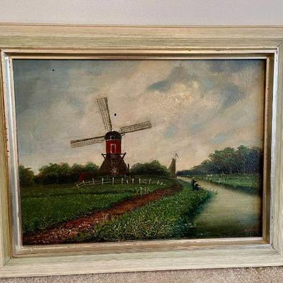 Lot 076-BR1: Windmill Painting #1

Features: 
â€¢	A green-scape of a large windmill, people fishing in a canal near the windmill, and...