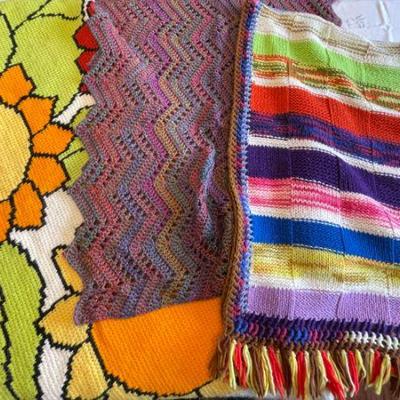 Lot 051-P: Vintage Knits

Description: Colorful handmade blankets and scarf


Reference Dimensions: 
â€¢	Orange and red floral: 54â€W x...
