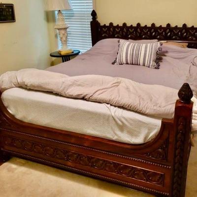 Lot 012-MBR: MC Spanish Revival European Queen Bedframe

Description: 
â€¢	Solid wood, ornately carved and quite heavy! An artisanal...