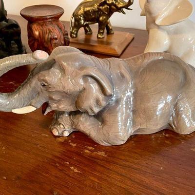 Lot 038-P: Here Come the Elephants! (Lot #1)

Description: An assortment of decorative ceramic, wood, and metal elephant figurines....