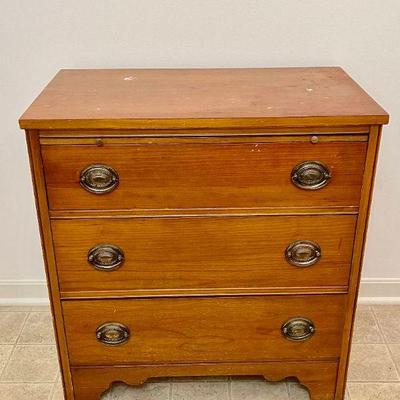 Lot 083-MBR: Small MC Chest of Drawers

Description: 
â€¢	Cherry wood piece
â€¢	Has 3 drawers plus a folding surface pull-out
â€¢	Would...