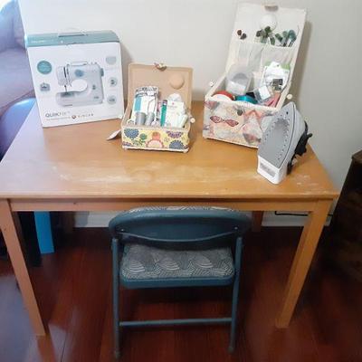 Blonde table with sewing items