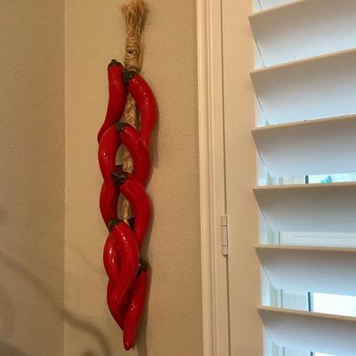Ceramic and rope hanging chili peppers