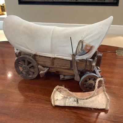 Conestoga wagon and birch canoe