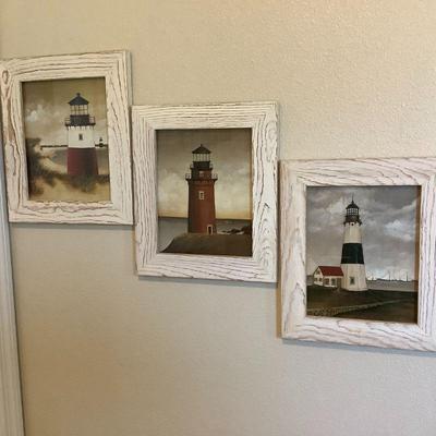 3 framed lighthouse pictures