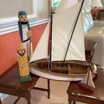 Folk art sailors and wooden sailboats