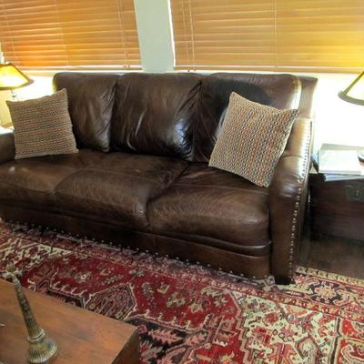 Arts & Crafts style bronzed metal lamps pair, comfy leather sofa w/ metal stud accents
