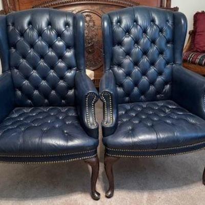 Pair of wing back button tufted chairs