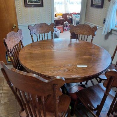 Round table and 6 pressed back chairs