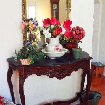 CARVED HEAVILY CURVED FROM CONSOLE WITH BLACK MARBLE TOP
