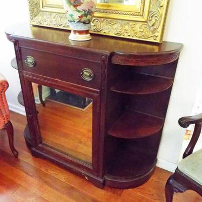 DEMILUNE SHELVING SIDES MIRROR MIDDLE CONSOLE,FLAMINGO PINK CHANNEL TUFTED 
ARMCHAIR, LARGE GILDED ORNATE RECTANGULAR MIRROR, SATSUMA VASE
