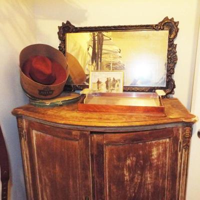 DISTRESSED CURVED FRONT DOORED CABINET AND MIRROR
