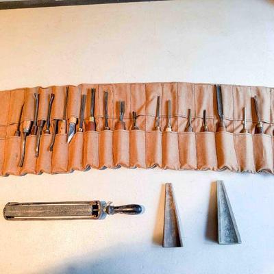 Roll of 25 carving tools, and 2 gouge sharpening stones, and an adjustable strop, Fair to Good
