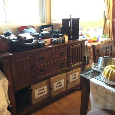 Vintage cameras and recorders, VHS tapes and player; side cabinet with 2 drawers, cabinets and tray pull-outs