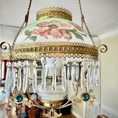Antique oil lamp converted to electric chandelier