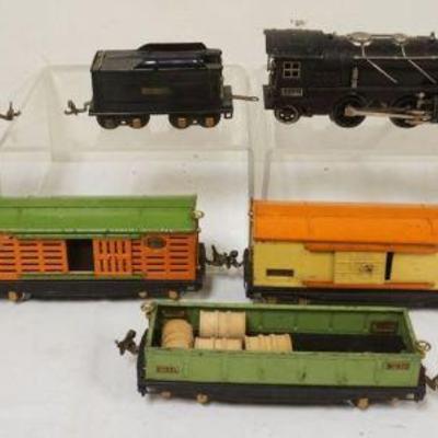 1082	LIONEL TRAIN O GAUGE #261E LOCOMOTIVE WITH TENDER  WITH 7 CARS. #815, TANKER, SEARCH LIGHT, #812, #813 CATTLE CAR
