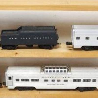 1098	LIONEL TRAIN O GAUGE #773 LOCOMOTIVE WITH NYC TENDER AND 4 SILVER CARS, SILVER CLOUD, SILVER DAWN, SILVER RANGE
