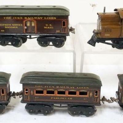 1023	IVES TRAIN O GAUGE #3250 LOCOMOTIVE WITH 4CARS, #60 BAGGAGE, #61 CHAIR CAR, #62 PARLOR

