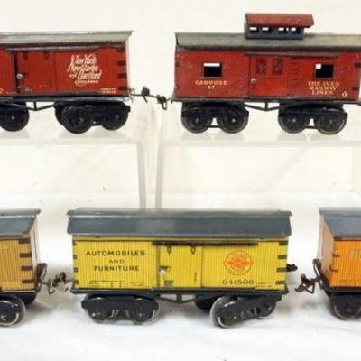 1052	IVES TRAIN O GAUGE  GROUP OF 5 CARS,#67 CABOOSE AND 4 BOX CARS

