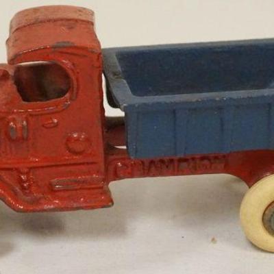1226	ANTIQUE CAST IRON TOY *CHAMPION* DUMP TRUCK, APPROXIMATELY 5 IN X 3 IN H
