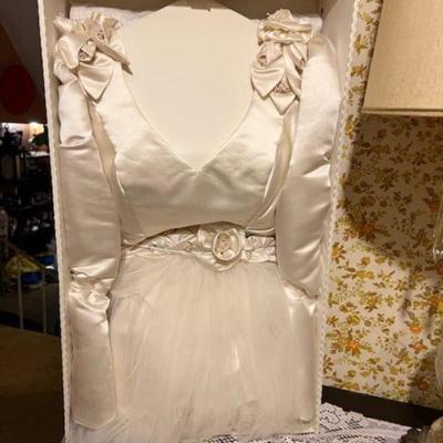 Gorgeous Elegant size 14 long sleeve Ivory Satin
Like New Still  in Dry cleaning Box