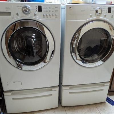 LG front load washer and dryer with stands