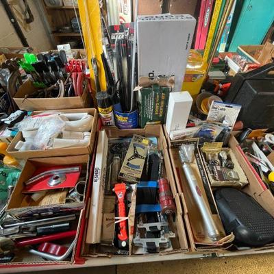 Mixed lot of tools and hardware for electrical and plumbing work, as well as other projects. 