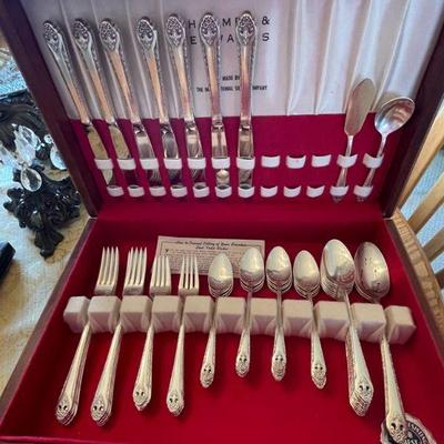 Holmes and Edwards silver-plated flatware 51-piece set, including serving pieces and original storage box.