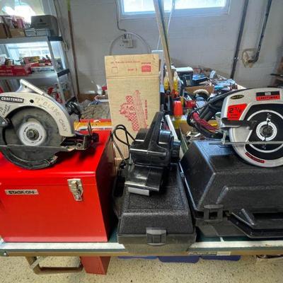Craftsman saws and sander with storage cases.