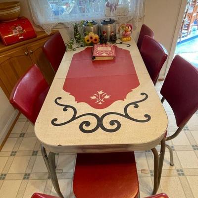 Vintage 1950s formica and chrome expandable table (leave inserted), and set of 6 vinyl and chrome chairs.