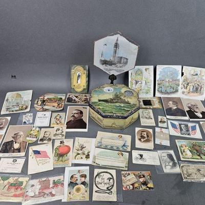 Lot 507 | Lot of Trade Cards and USS Idaho Ship Tin
