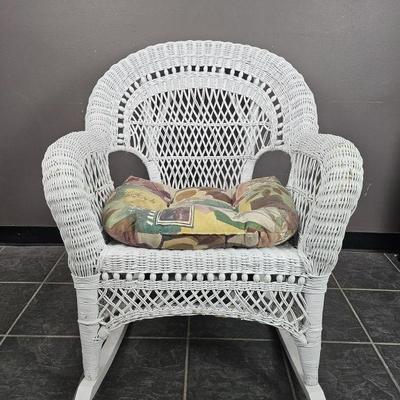Lot 515 | Vintage Wicker Rocking Chair w/ Cushion