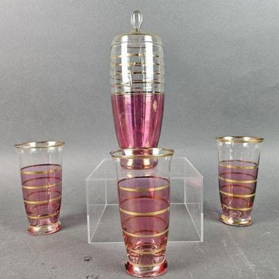 Lot 1061 | Art Deco Pink and Gold Glasses and Pitcher