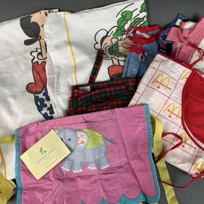 Lot 1371 | Vintage Aprons, Olive Oil, Popeye More
