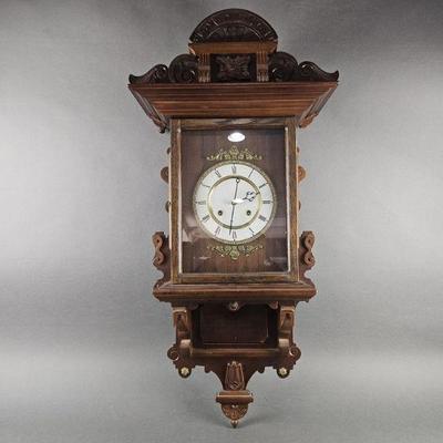 Lot 1199 | Vintage Wall Clock W/ Key & Pendulum
