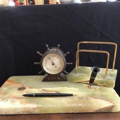 This desk set made by the waterbury clock company.  The stone is not known to me but do know there is a vein of this stone in New Haven...