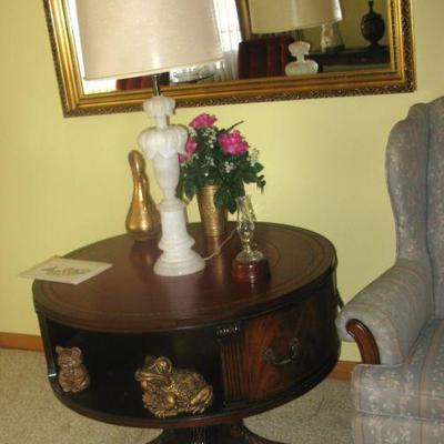 gold frame mirror $ 195.00
marble base lamp $ 155.00
drum table