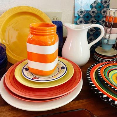 Colorful dishes by Elite and PT demitasse cups on a stand