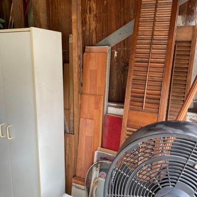 White storage cabinet, wooden shutters and more
