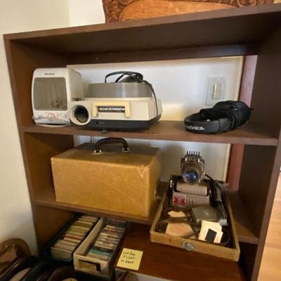 Vintage electronics including slide projectors by Kodak and Manumatic