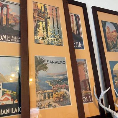 Assortment of framed travel posters from around the world