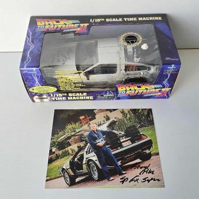 #4070 â€¢ Back To The Future Delorean & Signed Picture
