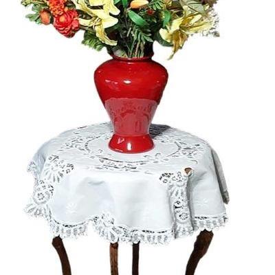 A Lovely Little Wood Side Table Topped With A Crisp Linen Table Cloth & Colorful Floral Arrangement