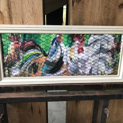 Original chicken painting framed under chicken wire.