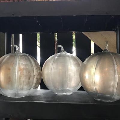 Three large glass pumpkins 